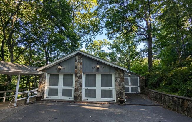 Unique Lake Lanier front home w/spectacular natural rock waterfall and dock