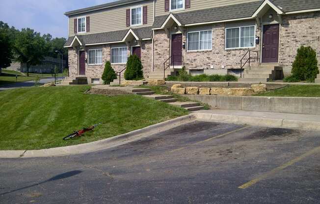 exterior of townhomes with a grassy slope in front