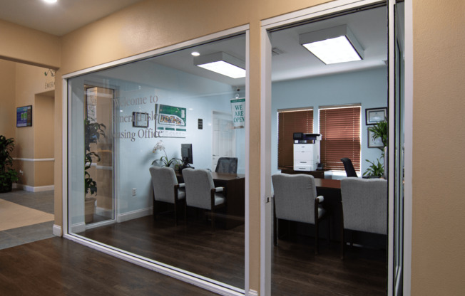 A glass door with a sign that says "Welcome to the Hiring Office" on it.,A glass door with a sign that says "Welcome to the Hiring Office" on it.