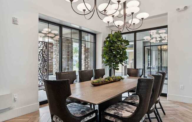 A dining room with a wooden table and chairs. at The Laurel Apartments, Chandler, 85286