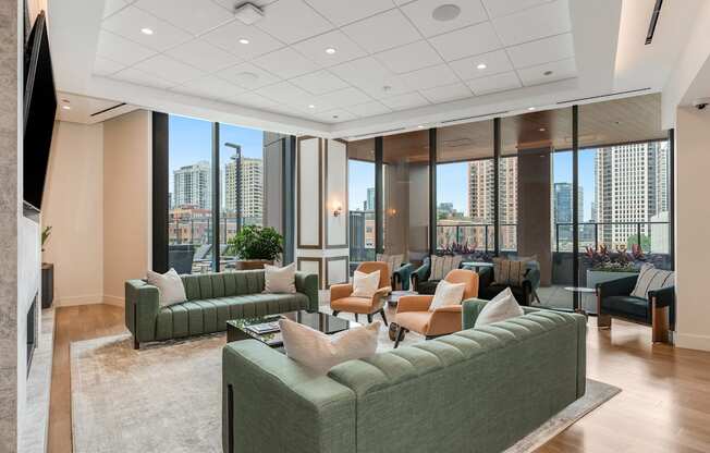 a living room with couches and chairs in front of windows  at Cassidy on Canal, Chicago