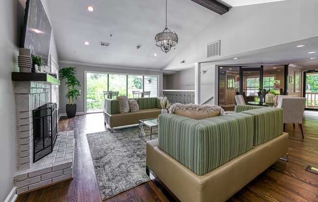 a living room with couches and a fireplace