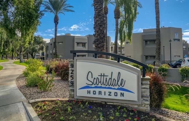 the sign at the entrance of scottsdale hotel on a tree lined street