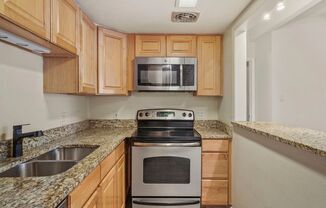Cozy Condo Retreat – Stylish 1-Bedroom with Fireplace & Balcony Near Dining & Shopping!