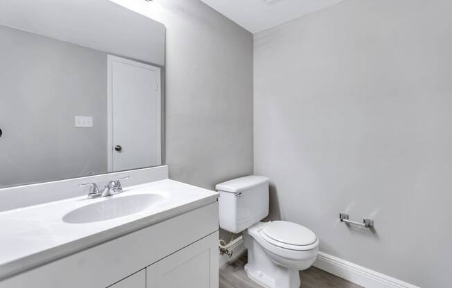 an empty bathroom with a toilet and a sink