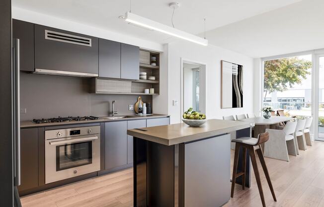 a kitchen with a large center island with a wooden countertop