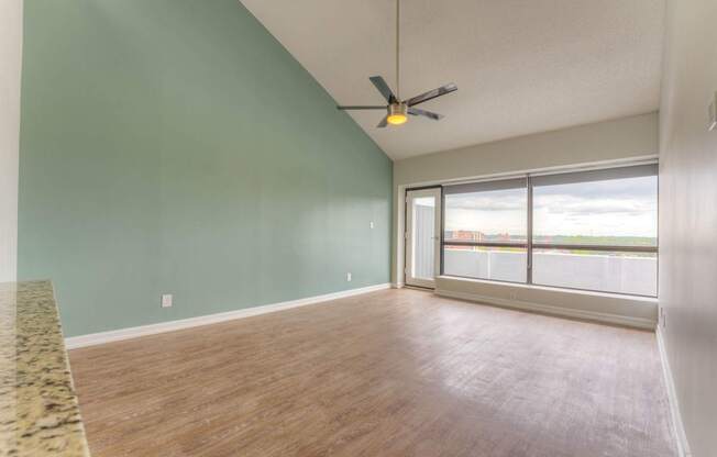 Empty room with a ceiling fan and sliding glass doors.at Iris Luxury Apartments, Tennessee