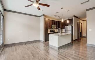 Nashville Apartments - Octave Apartments - Open concept floorplan with wood style floors granite countertops and gourmet kitchen with a large kitchen island and stainless steel appliances