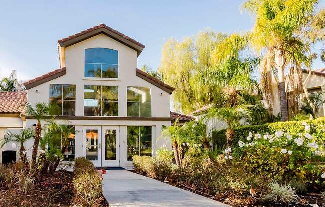 A house with a red tile roof and a glass door.