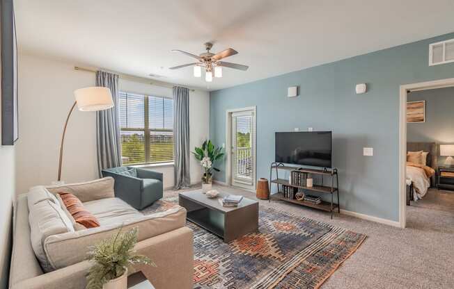 Spacious Living Room With Glass Patio Door Leading Out To Balcony