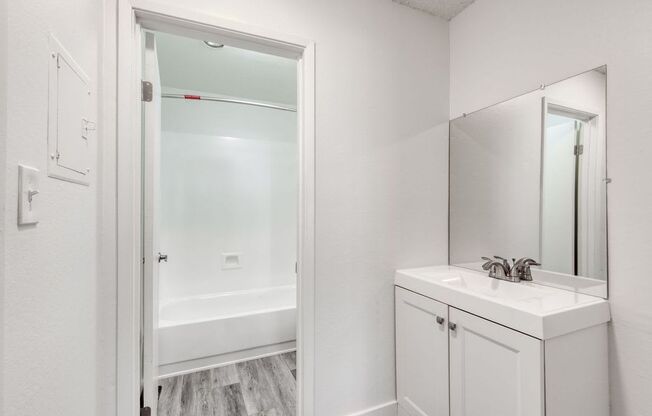 a bathroom with a sink and a bathtub