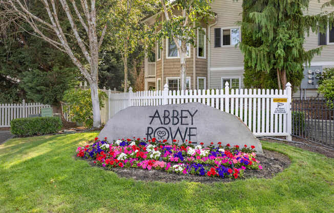 An entry sign for Abbey Rowe Apartments in Olympia, WA