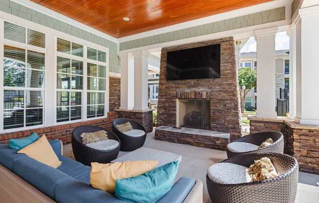 A living room with a fireplace and a television.