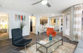 a living room with a couch and a glass table