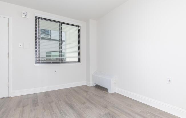 Vacant living room with wooden floors