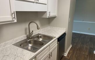 a kitchen with a stove and a sink