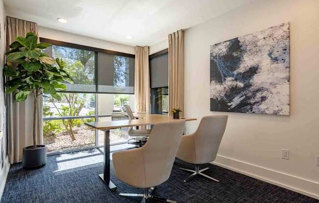 desk and chairs in conference room at slate scottsdale apartments