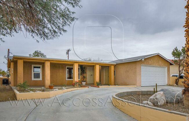 Charming 4 Bed/2.5 Bath Home With Spacious Backyard And Gated Entrance!