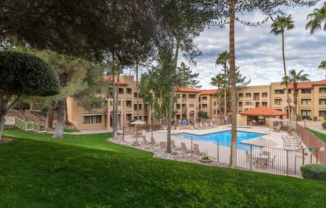 Foothills view of pool with nice lush landscape surrounding