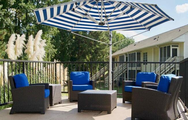 Sundeck with chairs and umbrellas  at Huntington Apartments, North Carolina, 27560