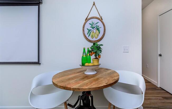 a dining room with a table and four chairs at Jefferson Yards, Tacoma Washington