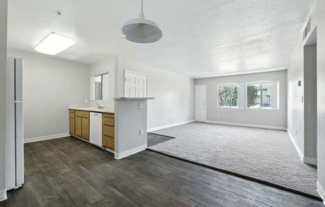 A kitchen with a dining area and a window.