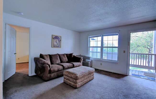 Image of carpeted room with furniture and window