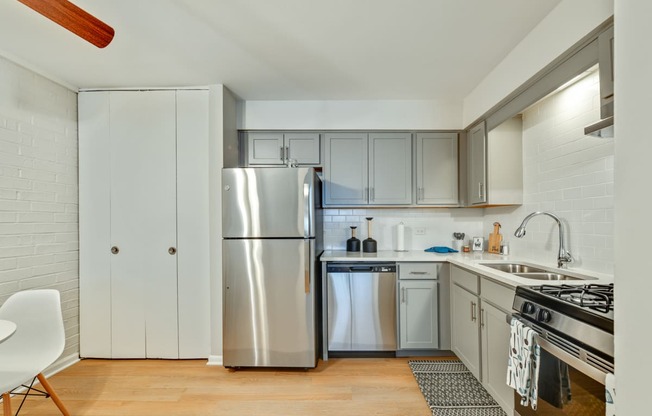 Bright kitchen appliances including a fridge, dishwasher machine, stove, and many more