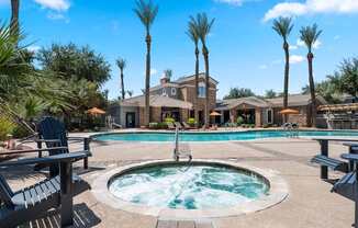 Swimming pool with hot tub at Artessa apartments near Arrowhead Mall