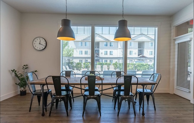 A dining room with a table and chairs at Forestplace Apartment Homes, Forest Grove, Oregon