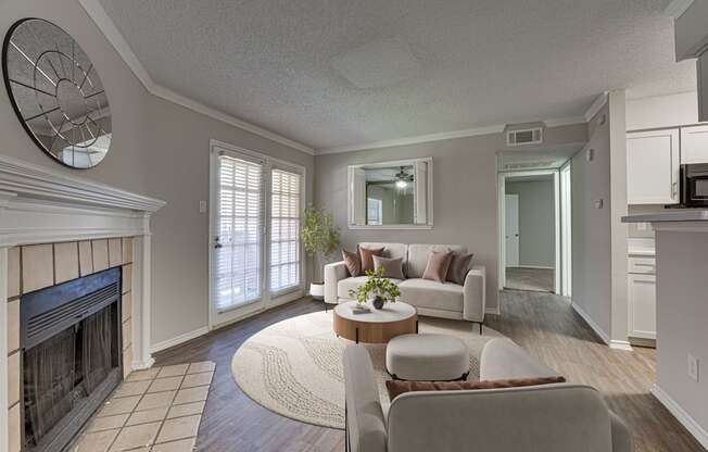 A living room with a fireplace and a couch.