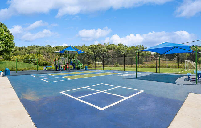 Community Sports Court and Playground Area at Elevate on Parkway Apartments, Minnesota, 55337 