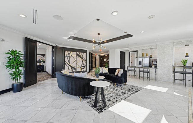 Spacious resident lounge with a black and white color scheme at Dominion Post Oak apartments in Houston, TX