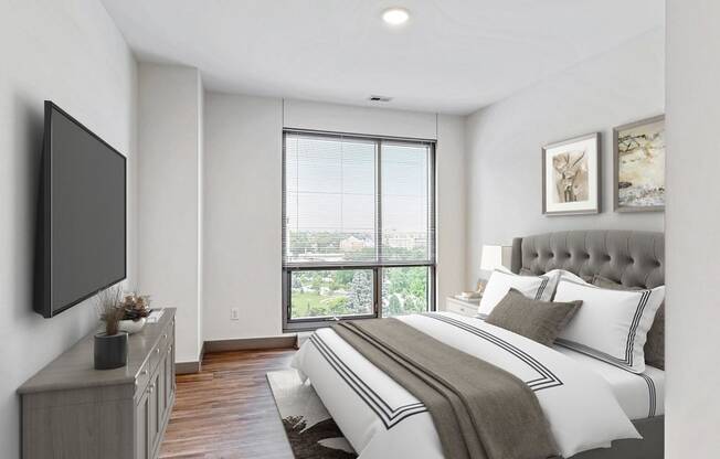 Spacious bedroom with floor-to-ceiling windows a 2 bedroom penthouse floor plan Midtown Crossing Apartments Omaha