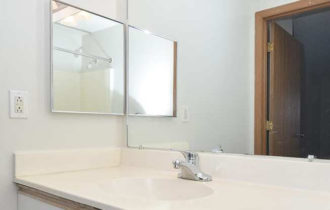 Bathroom with Vanity and Built-In Overhead Lighting