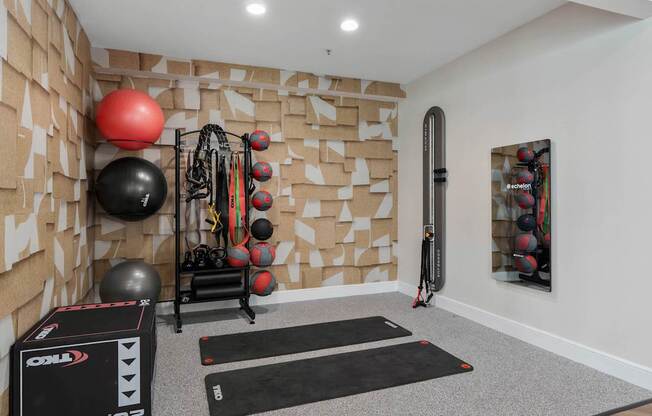 A gym room with a variety of exercise equipment. at The Orchard, Dublin, OH