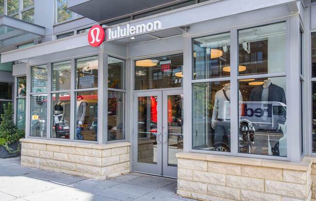 A Lululemon storefront with a red logo above the entrance.