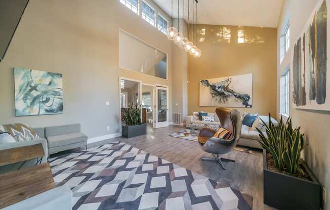 a living room with a couch and a chair in front of a window at Bay Village, California, 94590