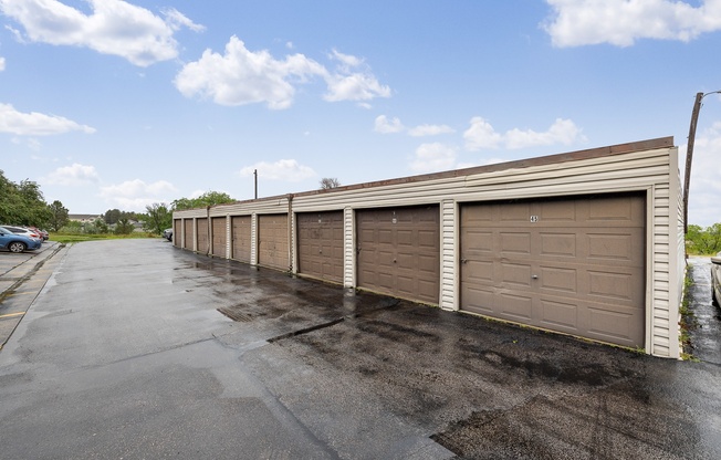 A long row of garage doors are closed.
