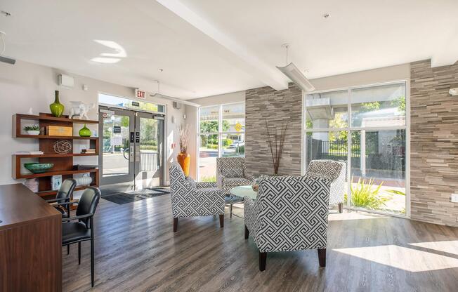 a living room filled with furniture and a large window