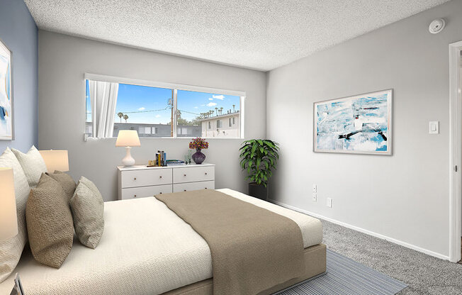 Carpeted bedroom with large window for natural light.