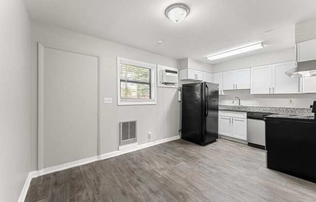 a kitchen and living room with a refrigerator and dishwasher  at Balfour 296, Georgia, 30047