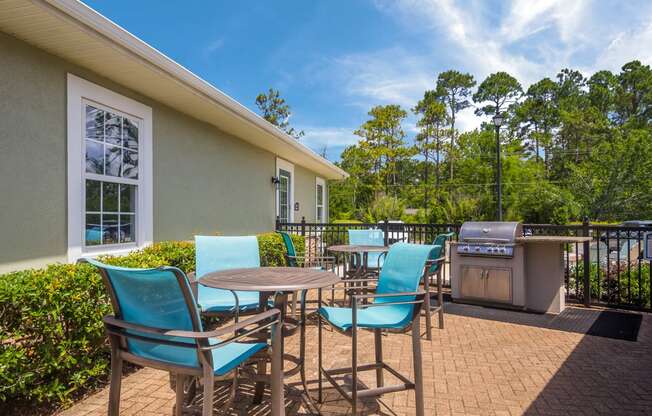 Outdoor grill area perfect for barbecues at Angel Landing apartments in Pensacola, FL