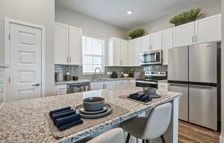 Gourmet Kitchen with Island at Avilla Cypress Creek, Sun City Center, FL 33573