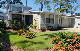 A house numbered 36 with a garden in front.