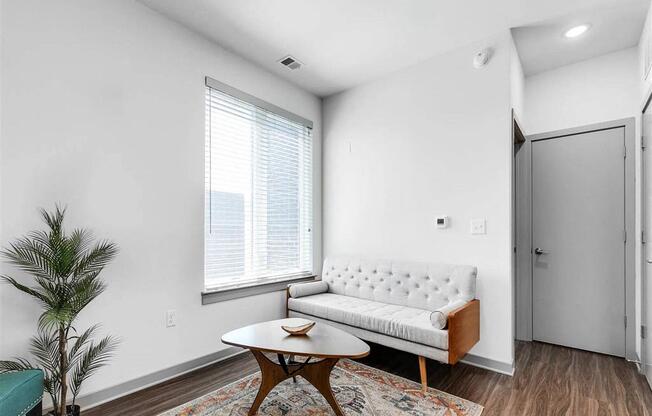 a living room with a couch and a table