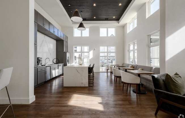 a large living room with a kitchen and a dining room at The Fitzroy San Marcos, San Marcos, TX
