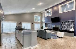 A modern kitchen with a grey and white color scheme.