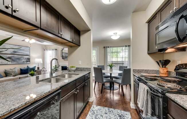 Mount Vernon Apartments | Desoto TX | Modern Kitchen with Shaker Style Expresso Cabinets