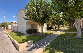 Desirable End-Unit Townhome with 2-Car Garage & Private Courtyard